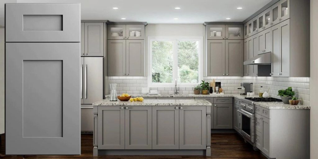 20 Types of Kitchen Cabinets 6 White recessed panel kitchen cabinets with marble countertops.