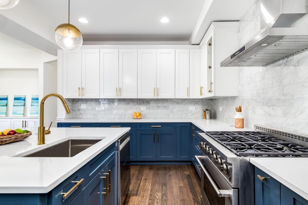 20 Types of Kitchen Cabinets 19 Modern two-tone kitchen cabinets with white wall cabinets and blue base cabinets.